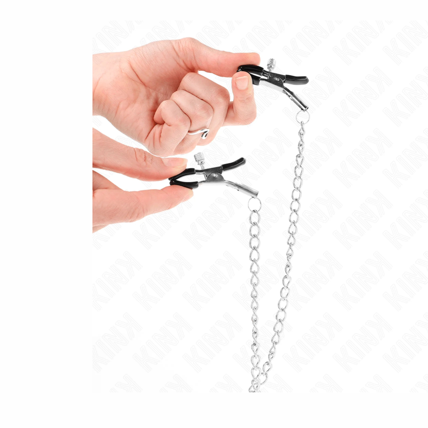Dettaglio manopole nere e meccanismo metallico pinze nipple clamp