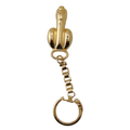 Goldener Schlüsselanhänger in Phallusform