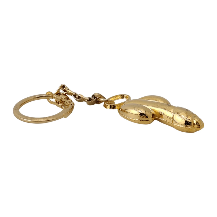 Goldener Schlüsselanhänger in Phallusform