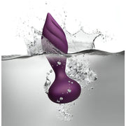 Plug anale Desire viola impermeabile a spirale immerso nell'acqua con spruzzi